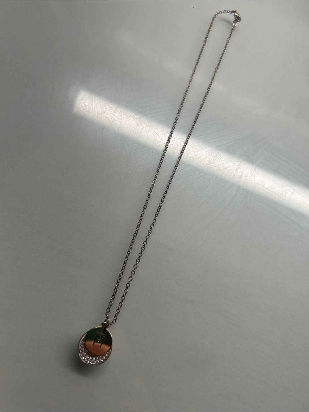 Gold-Tone Necklace with Enamel M Pendant and Crystal Accent